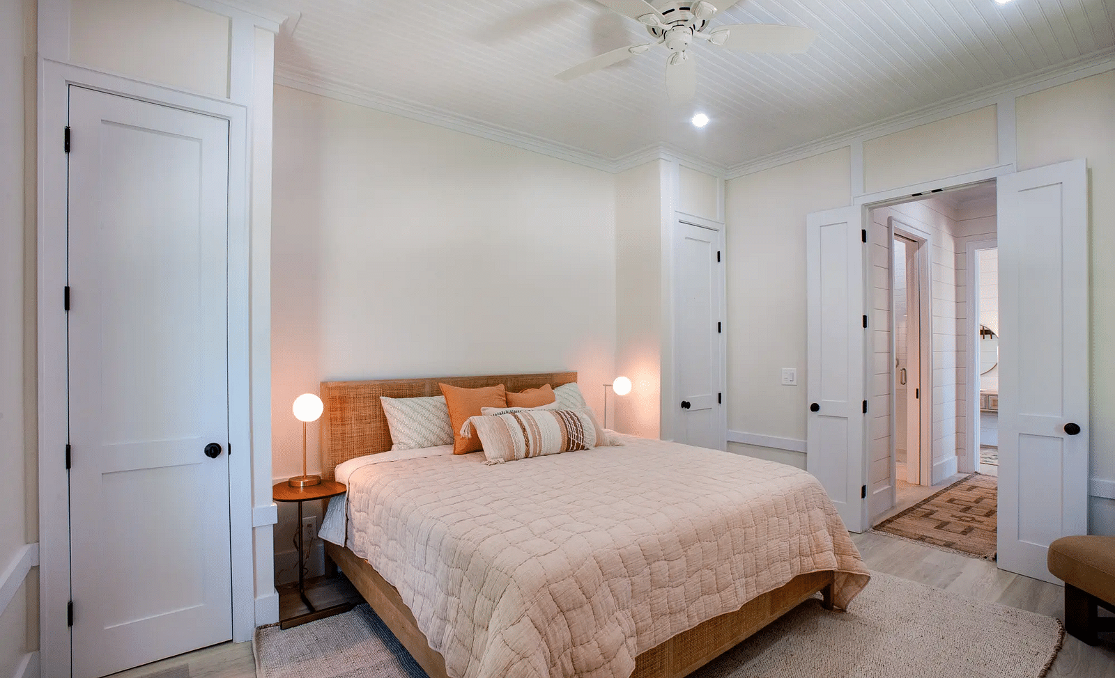 Bedroom with a double bed, bedside lamps, and a ceiling fan | Abaco Inn
