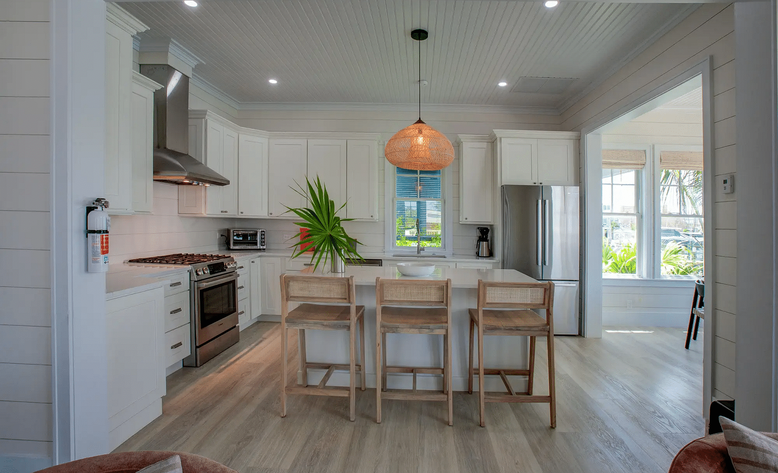 Dining area with wooden accents and a modern light fixture | Abaco Inn