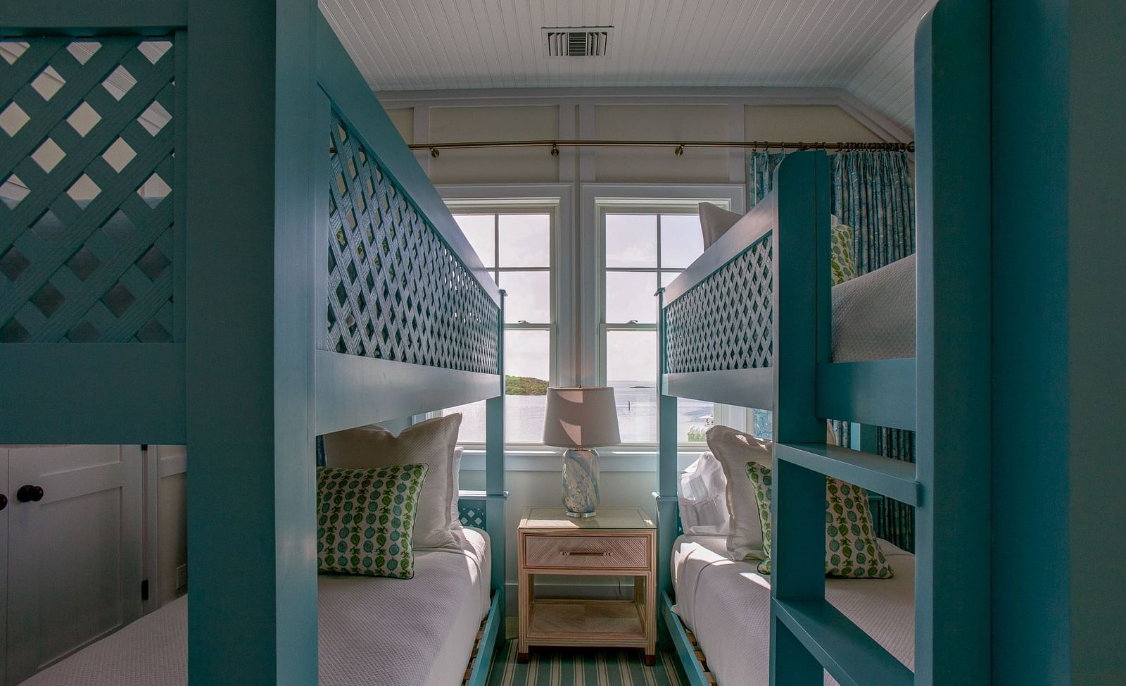 A bedroom at Abaco Inn featuring a sturdy bunk bed structure with multiple sleeping berths, designed for efficient use of space 