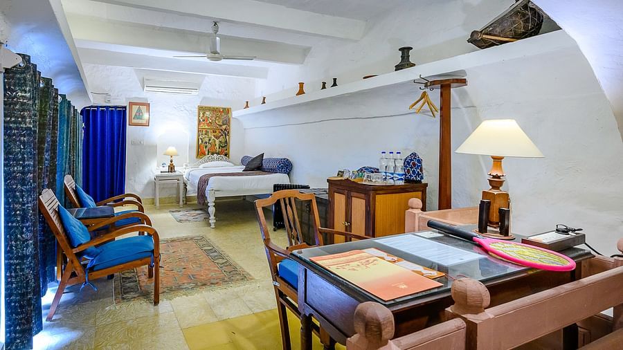 Hill Fort Kesroli 14th Century Alwar - Interior view of the Naqqar Khana Mahal - Village View featuring a bed and clue-coloured decor