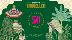 Cover page of Outlook Traveller magazine featuring a design inspired by the Mughal era, with a palm tree, swimming pool, and flowers floating on the water.