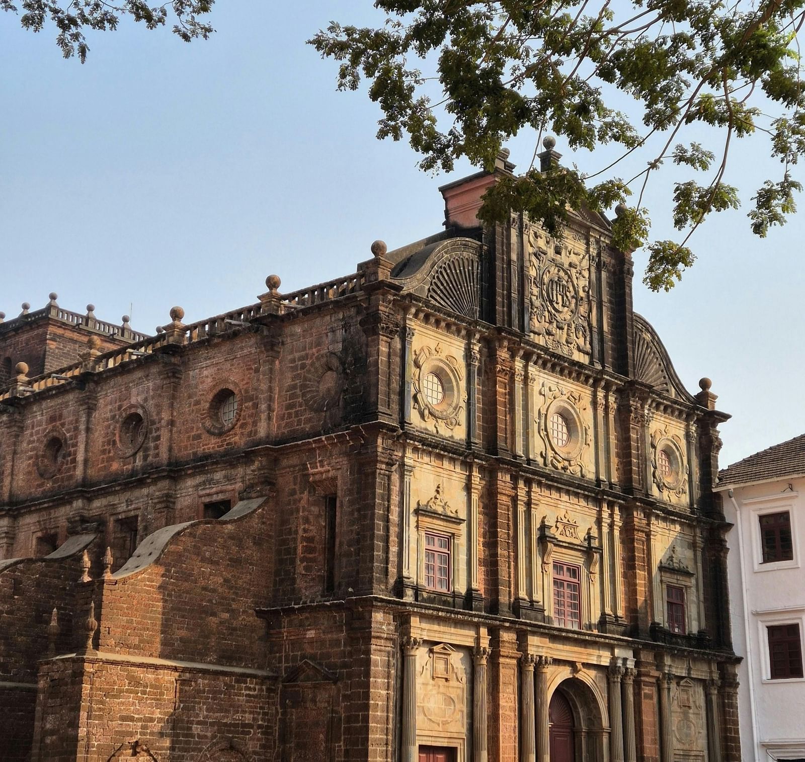 Exterior shot of Basilica of Bom Jesus Church taken from the corner of a street on a bright morning.