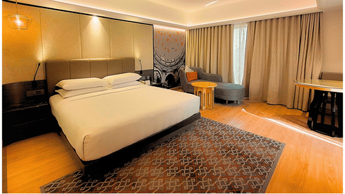 Deluxe Room with seating area and large windows