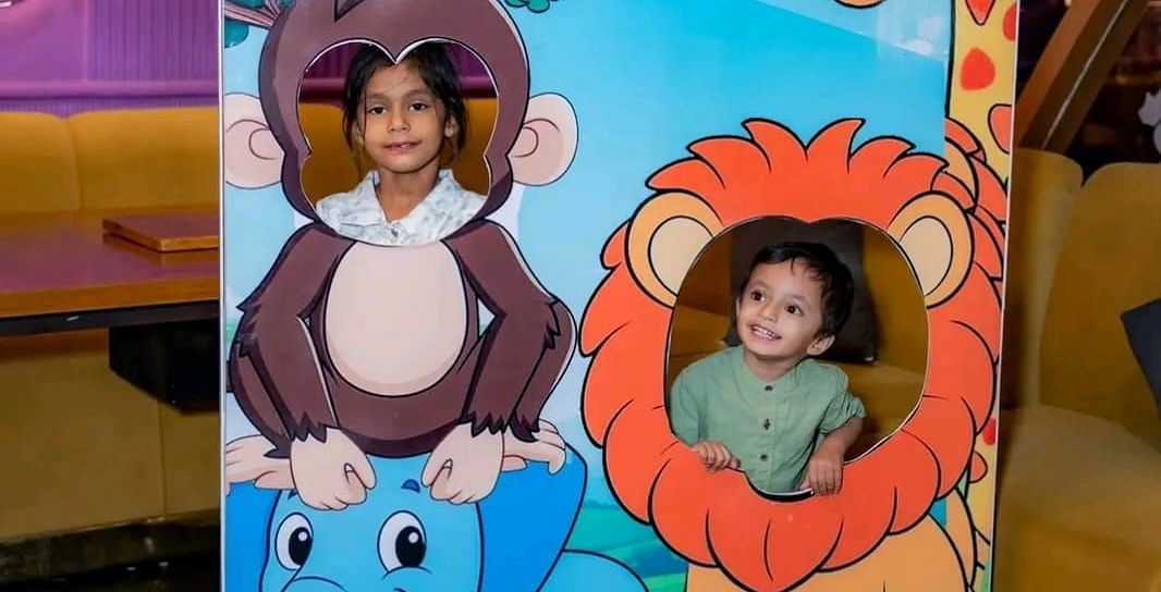Children posing for a photo at Themis Barbecue House, Ambala