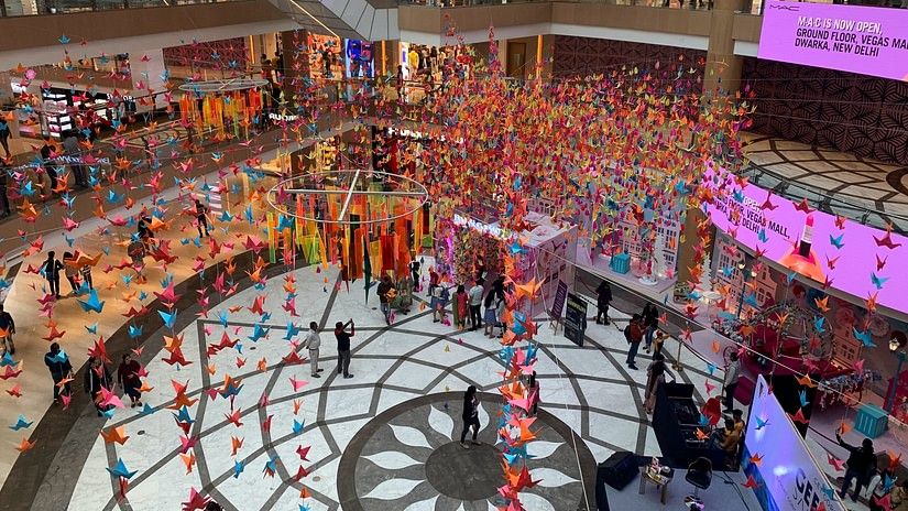 Interior of a shopping mall in Chennai with people walking 