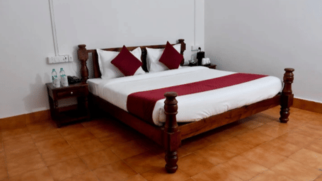 A Premium Room at Estherea Bagh, Ranthmabore, featuring a plush double bed on tiled floor in a spacious room.