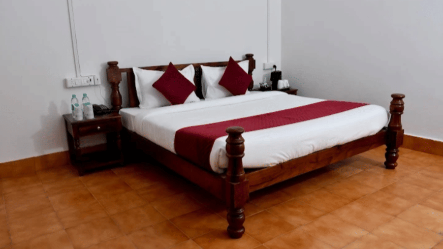 A Premium Room at Estherea Bagh, Ranthmabore, featuring a plush double bed on tiled floor in a spacious room.