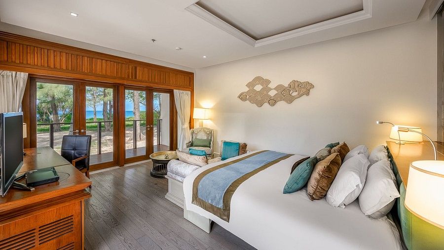 image of an elegant bedroom with modern interiors - two bedroom private pool beachfront villa