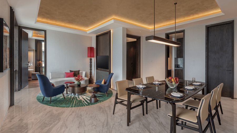 Executive Suite Room 8027 living room with a dining table and seating area at The Residency Signature Madurai.
