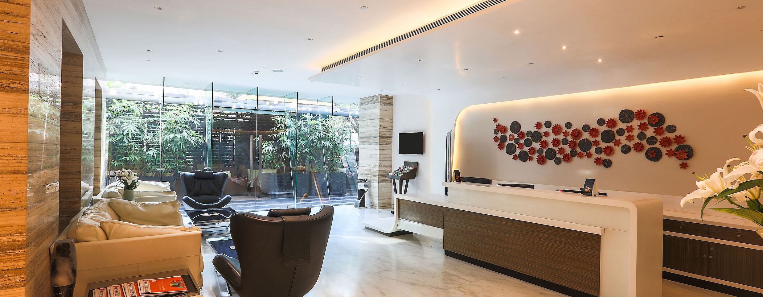A picture of  lounge at Empresa hotel, featuring seating arrangements.