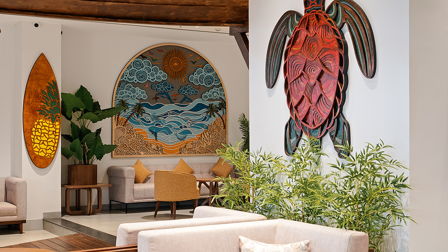 Sofas and artwork adorn the walls in the lobby of Cloud9 Sarovar Premiere, Palolem Goa, creating a welcoming atmosphere