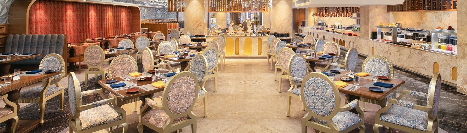 A spacious dining hall featuring modern decor and warm lighting - Kaldan Samudhra Palace