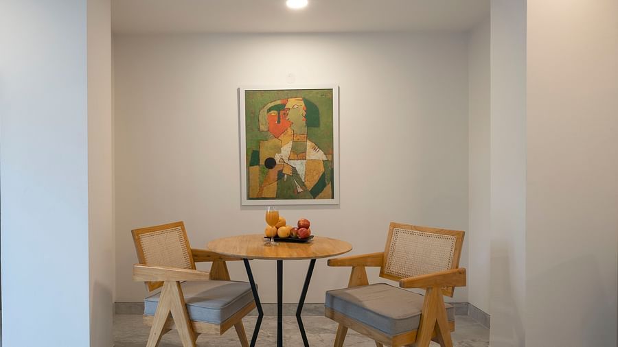 Cosy corner with chairs and round table at Nest by Rivido Apart Hotel, Bannerghatta Road