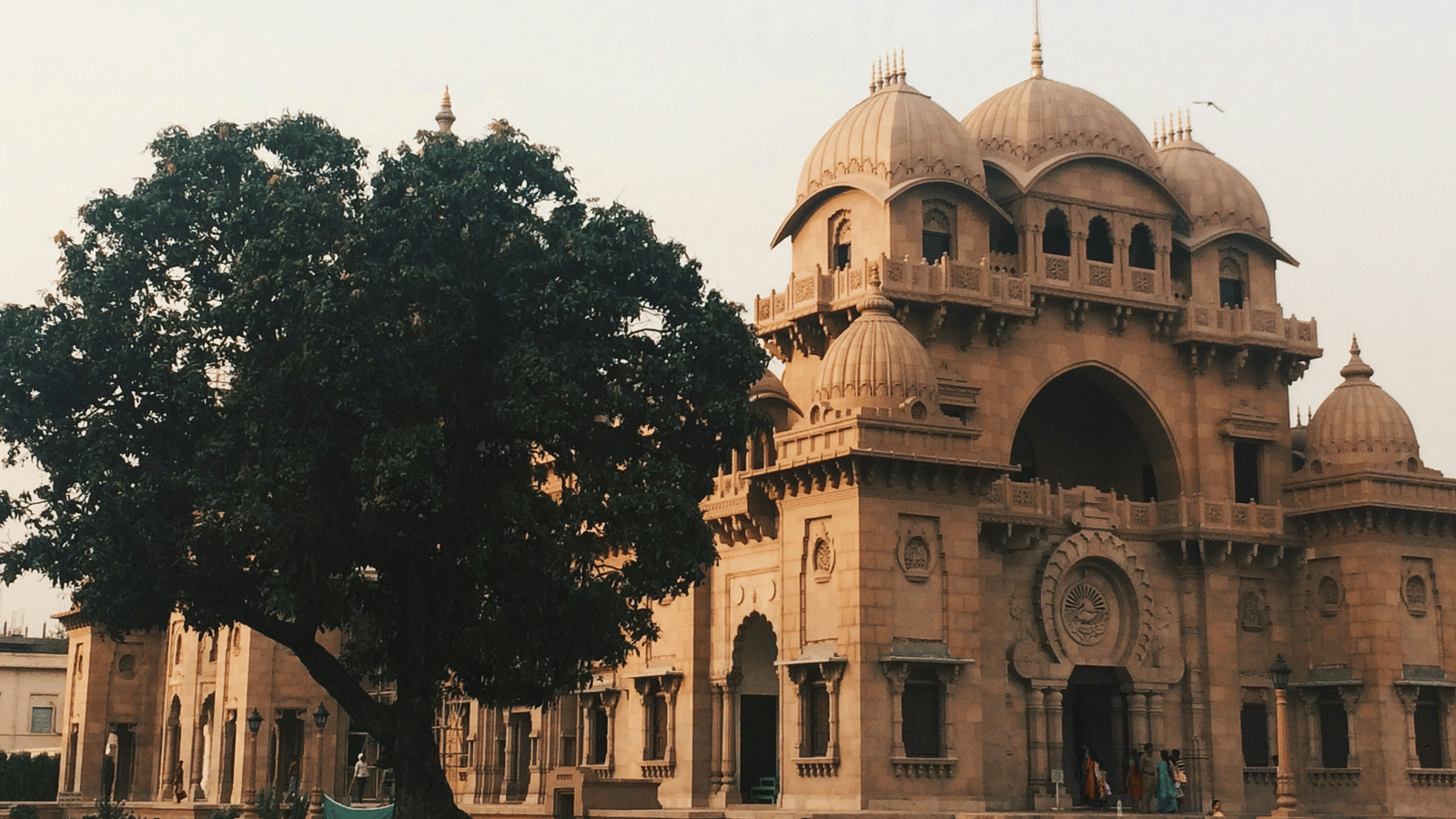 Belur Math in Kolkata with a tree in the front.