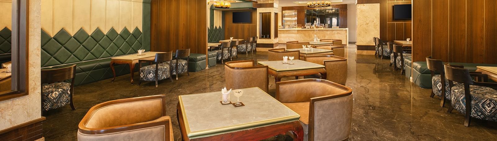 An upscale bar in Mahabalipuram with contemporary interiors and golden accents - Kaldan Samudhra Palace