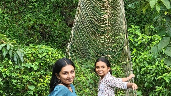 a woman and a girl posing on the walkway - Holistic Stay Eco Resort, Kannur