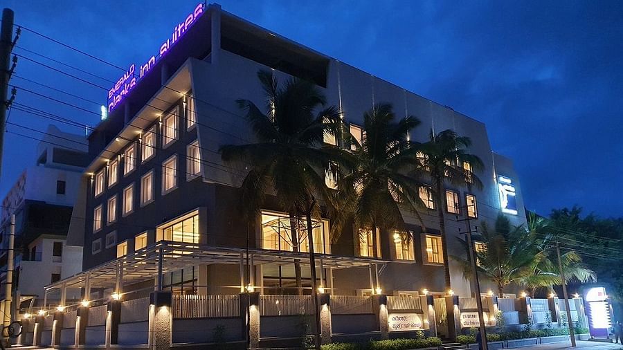 Hotel exterior in night sky with warm lighting around