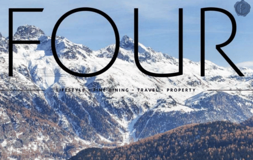 A woman placing her hands over her heart in a gesture of gratitude or calm.