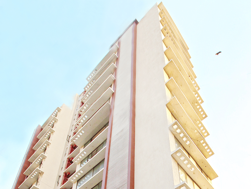 Exterior facade as viewed from below with the blue sky in the background of Theory9, Khar.
