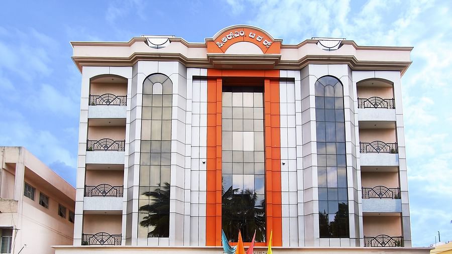 Facade of The President Hotel Jayanagar, Bangalore with striking red accents and a majestic entrance, showcasing a blend of traditional and contemporary architecture 