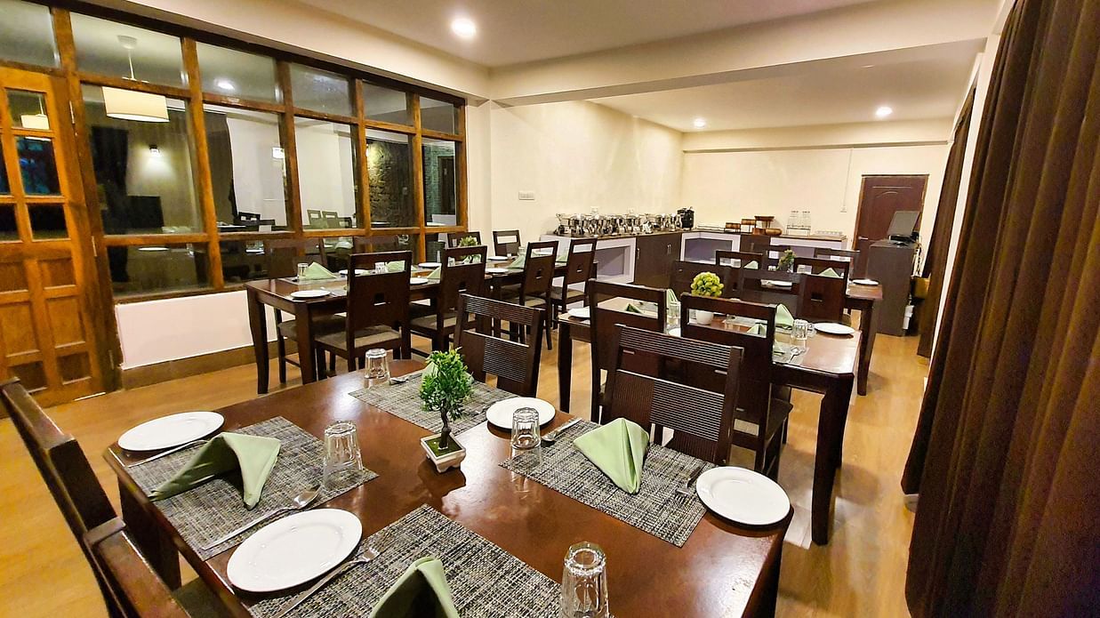 Dream Villa Retreat, Pelling - Crockery kept on the table in the interiors of our restaurant in Pelling