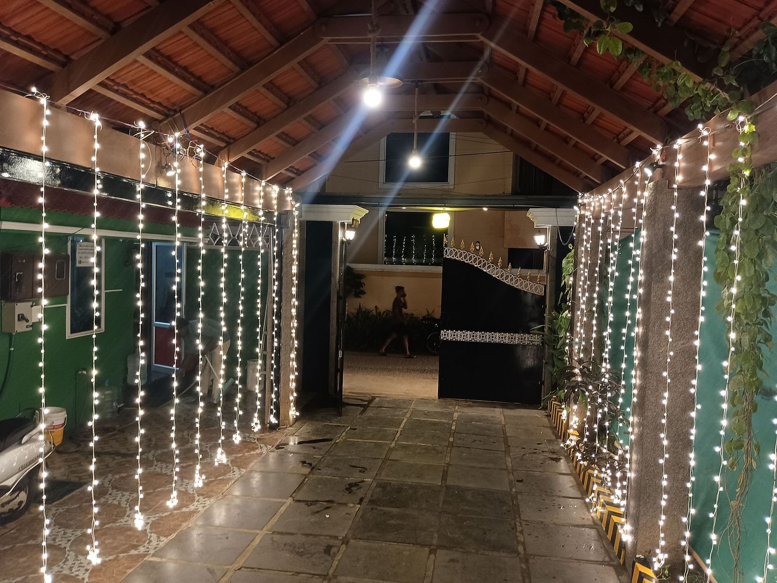 Image of the entrance way of Villa Serenity Le Sejour, Pondicherry with decorative lights on both sides.