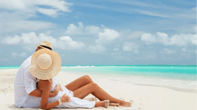 An image of couple relaxing on a pristine beach - S Hotel Montego Bay, Jamaica