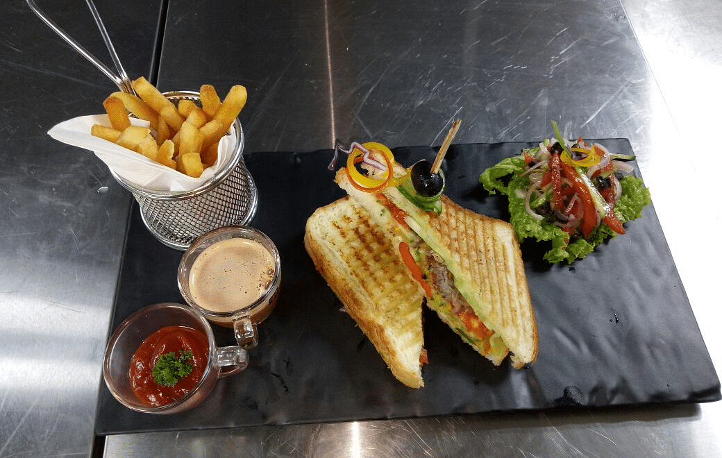 Grilled cheese sandwich with fries and dip.
