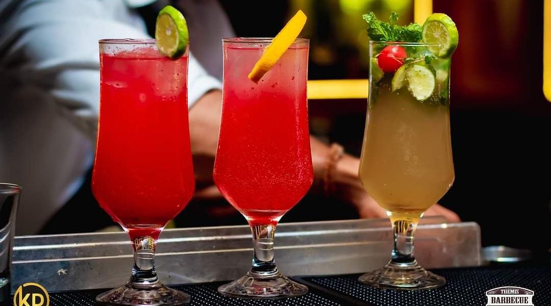 An image of a glass drinks placed on a table at Themis Barbecue House, Panipat
