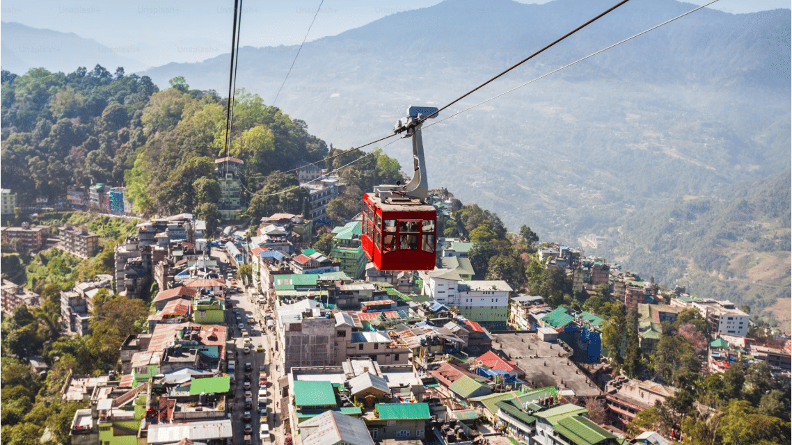 A view of a ropeway and picturesque view of Gangtok