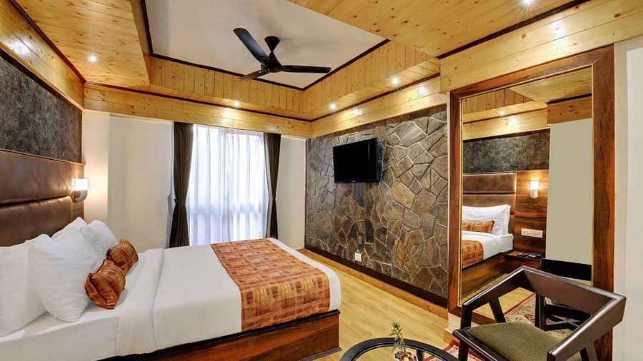 Premium  Room bedroom with a large bed and fan with large windows during daytime - Sumi Queensyard, Darjeeling