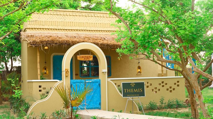 exterior of luxurious suite surrounded by lush greenery at Themis Mudhouse - A Nature's Retreat Resort & Wellness