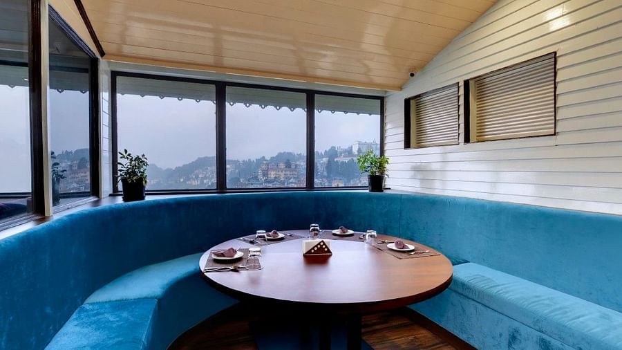 Lobby image of Sumitel Darjeeling featuring a round lounge seating with a round table
