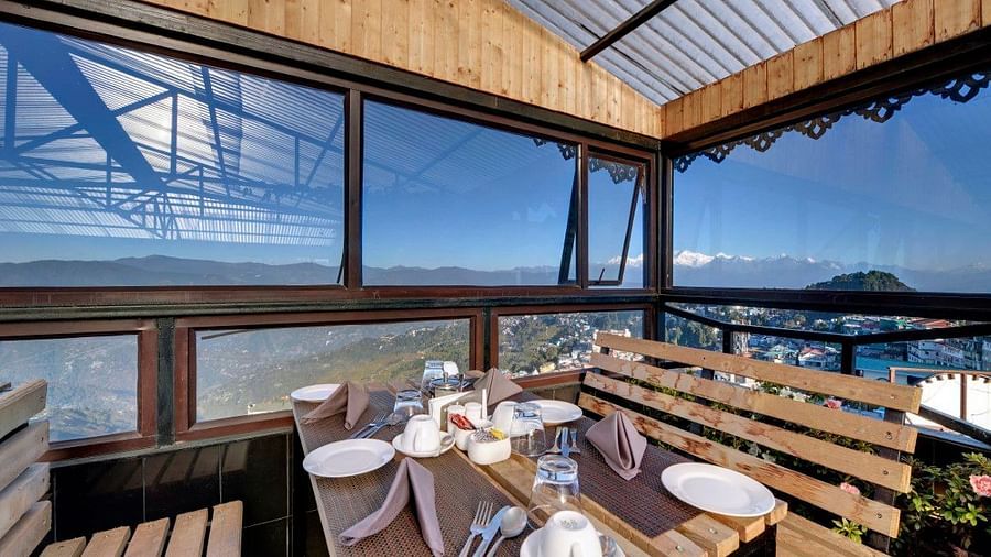 Restaurant of Sumitel Vista featuring seating area with table set up with cutlery