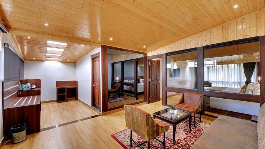 An image of a room with sofa sets, centre table and minimal decoration - Sumitel Vista TV Tower