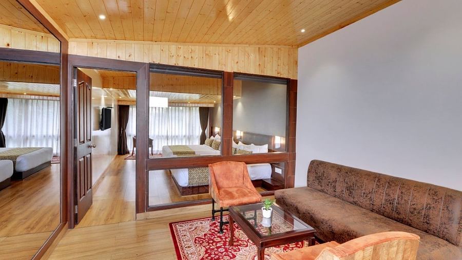 An image of a room with sofa sets, centre table and minimal decoration - Sumitel Vista TV Tower