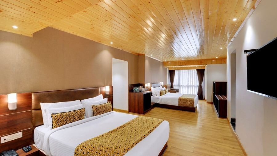 An image of a room with two queen size beds, TV and minimal decoration - Sumitel Vista TV Tower