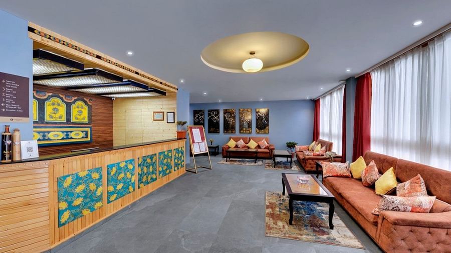 Image of the reception at the property with a cosy couch  | Yashshree Lachung