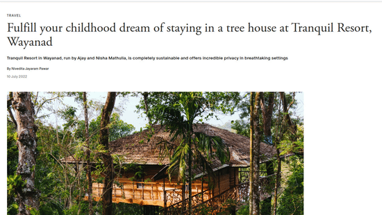 An Architectural Digest feature highlighting a sustainable wooden treehouse built high within the lush forest canopy at Tranquil Resort, Wayanad.