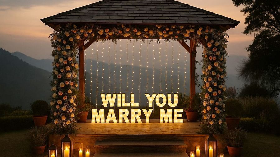 Gazebo lit with fairy lights and Will You Marry Me sign, perfect for unforgettable proposals in scenic surroundings.