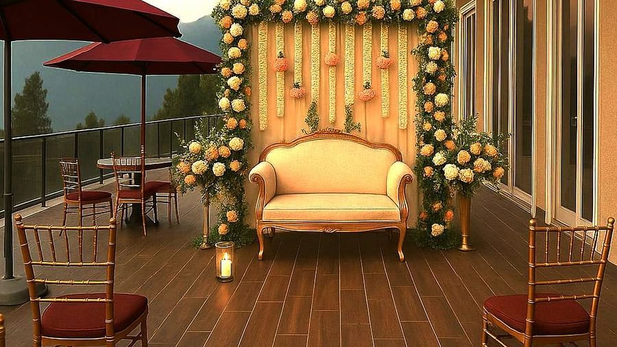  A floral backdrop with a vintage loveseat on the terrace of The Manor Sports & Wellness Hotel, styled for a photo op with elegant sunset mountain views.