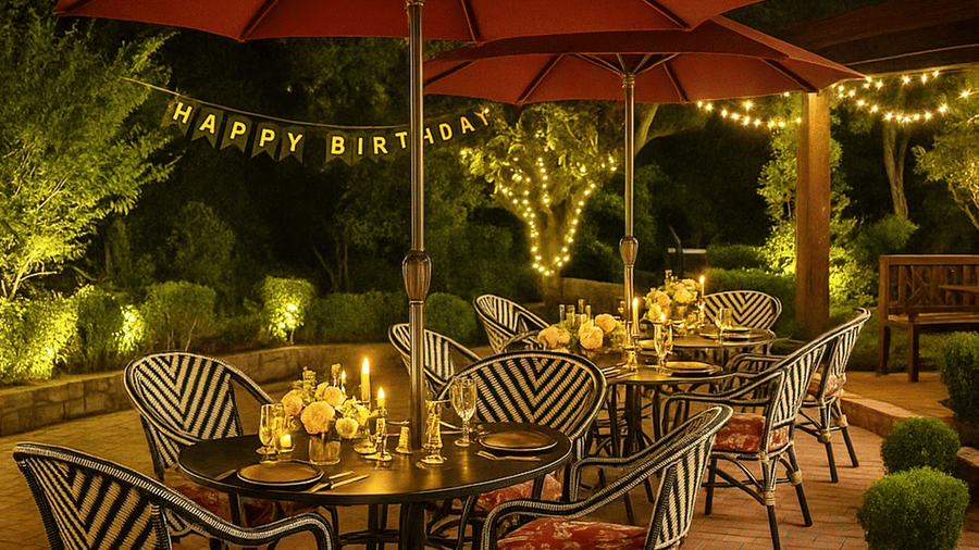 Outdoor birthday dinner setup with warm lighting, candles, and festoon lights at Beca Mario restaurant, providing the best food in Shimla, inside The Manor Sports & Wellness Hotel, creating a cosy and elegant evening ambience.