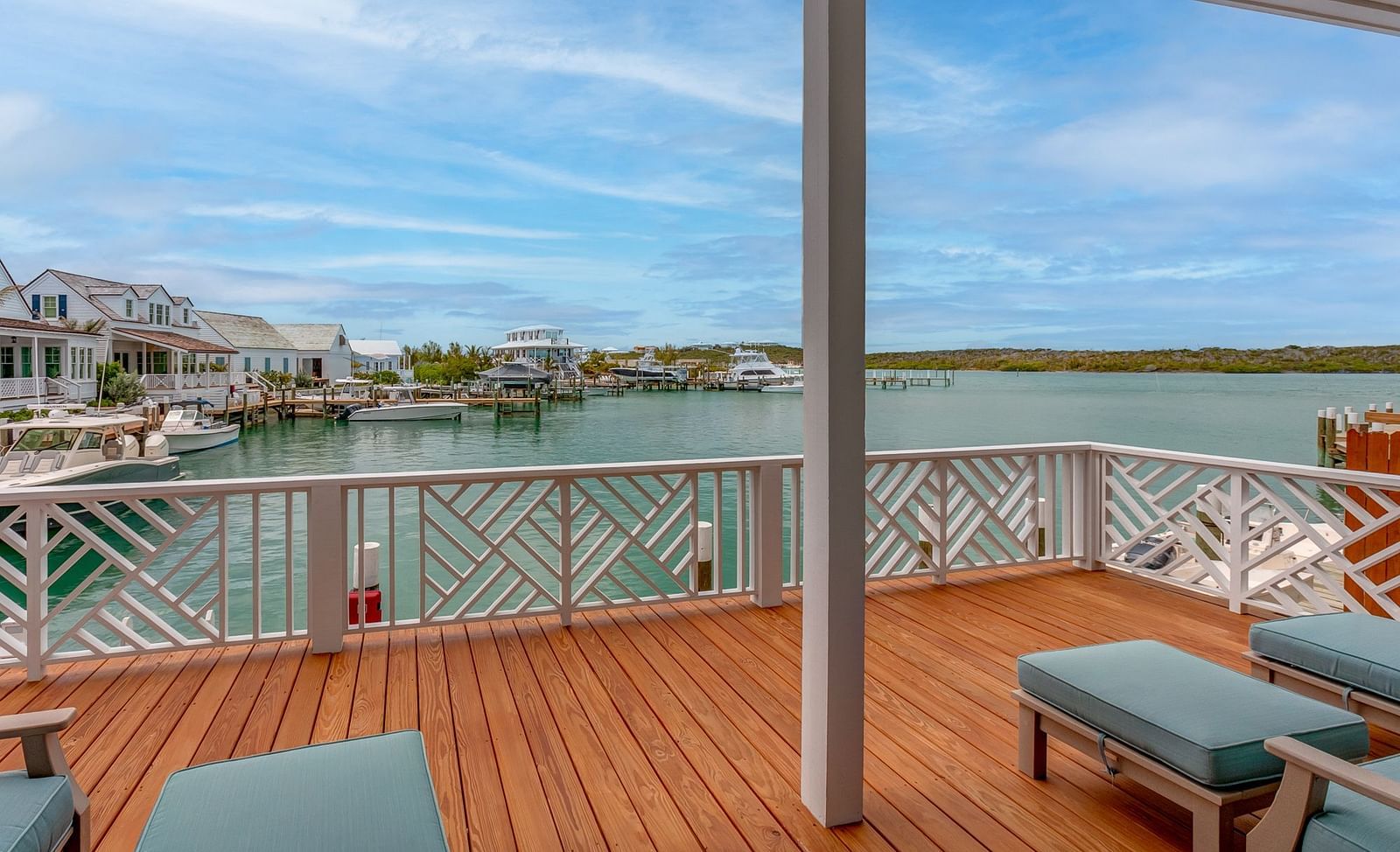 Wooden deck with seating overlooking the waterfront and scenic views | Abaco Inn