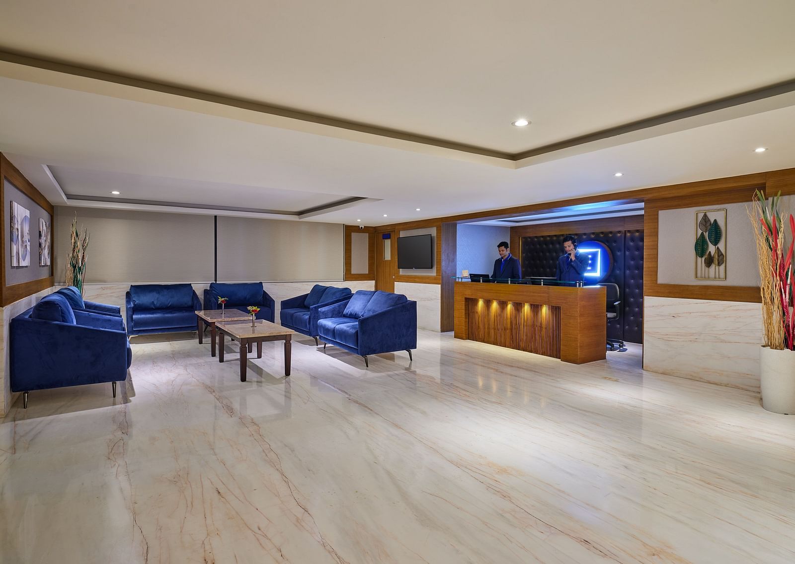 Lobby area of Essentia Premier Hotel, Chennai with sofa seating and a reception desk
