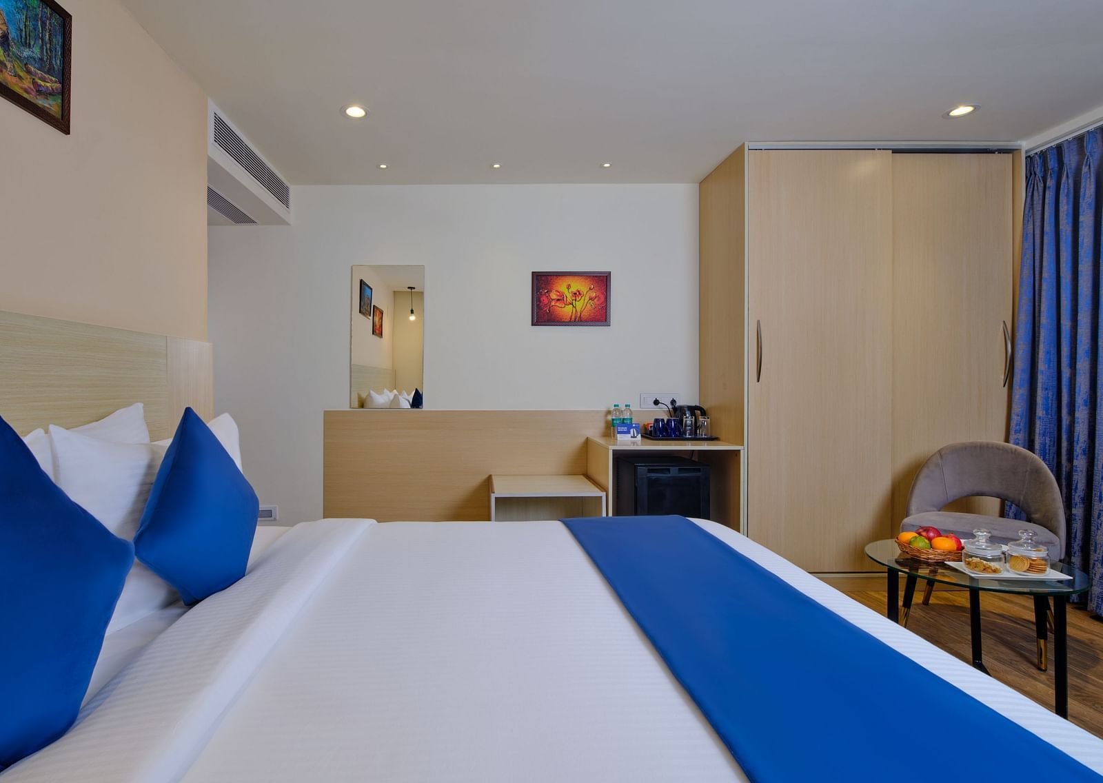 A room at Essentia Premier Hotel, Chennai with a double bed and a wardrobe