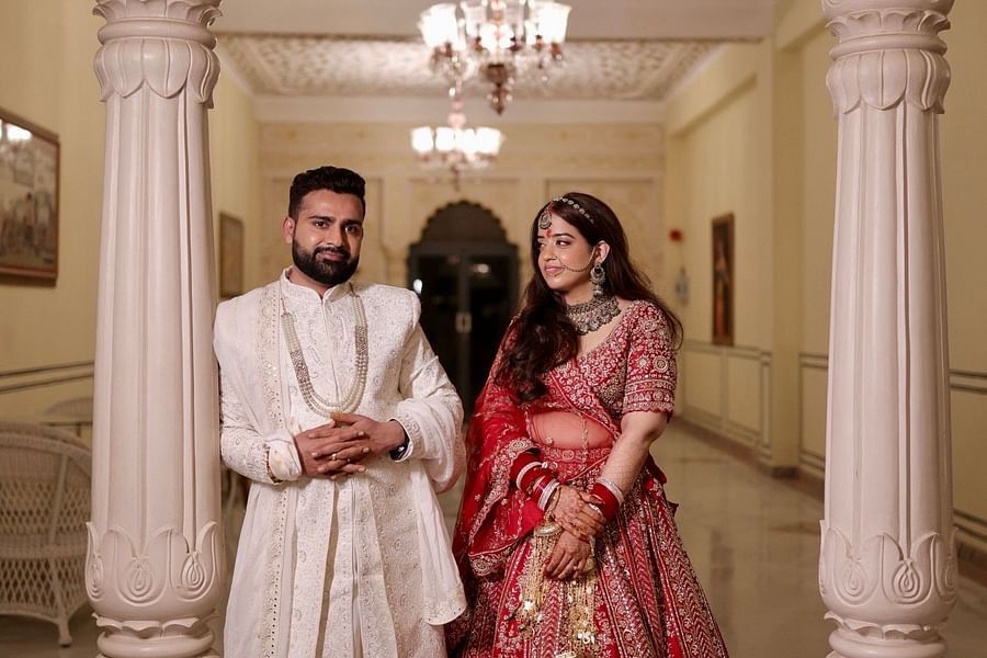 Elegant entry of Advait & Akshay at the palace corridor, dressed in wedding finery.