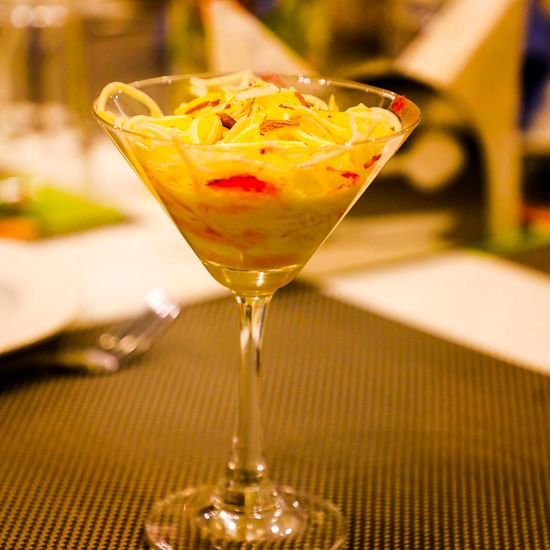 A glass filled with a drink at our restaurant - Kyriad Hotel, Nashik
