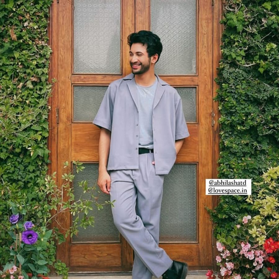 Image of Actor Rohit with a backdrop of beautiful green decoration