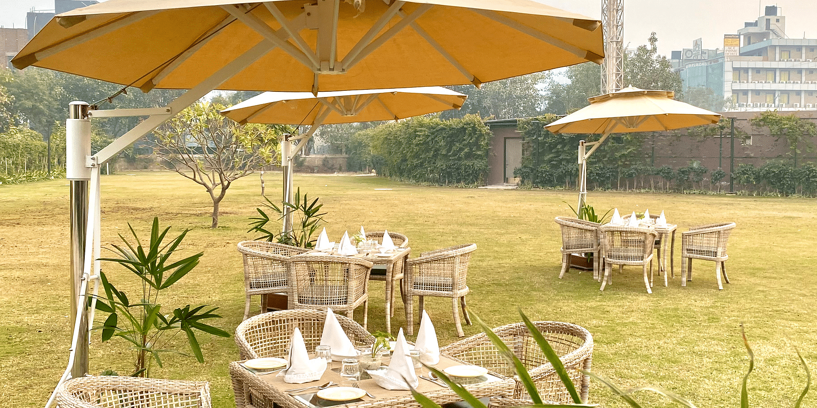 An image of the outdoor event space with seating arrangement - Hideaway banquets & Lawns, Greater Noida