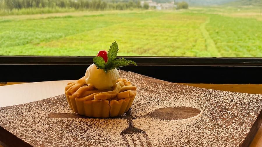 A cupcake placed on a surface overlooking the window